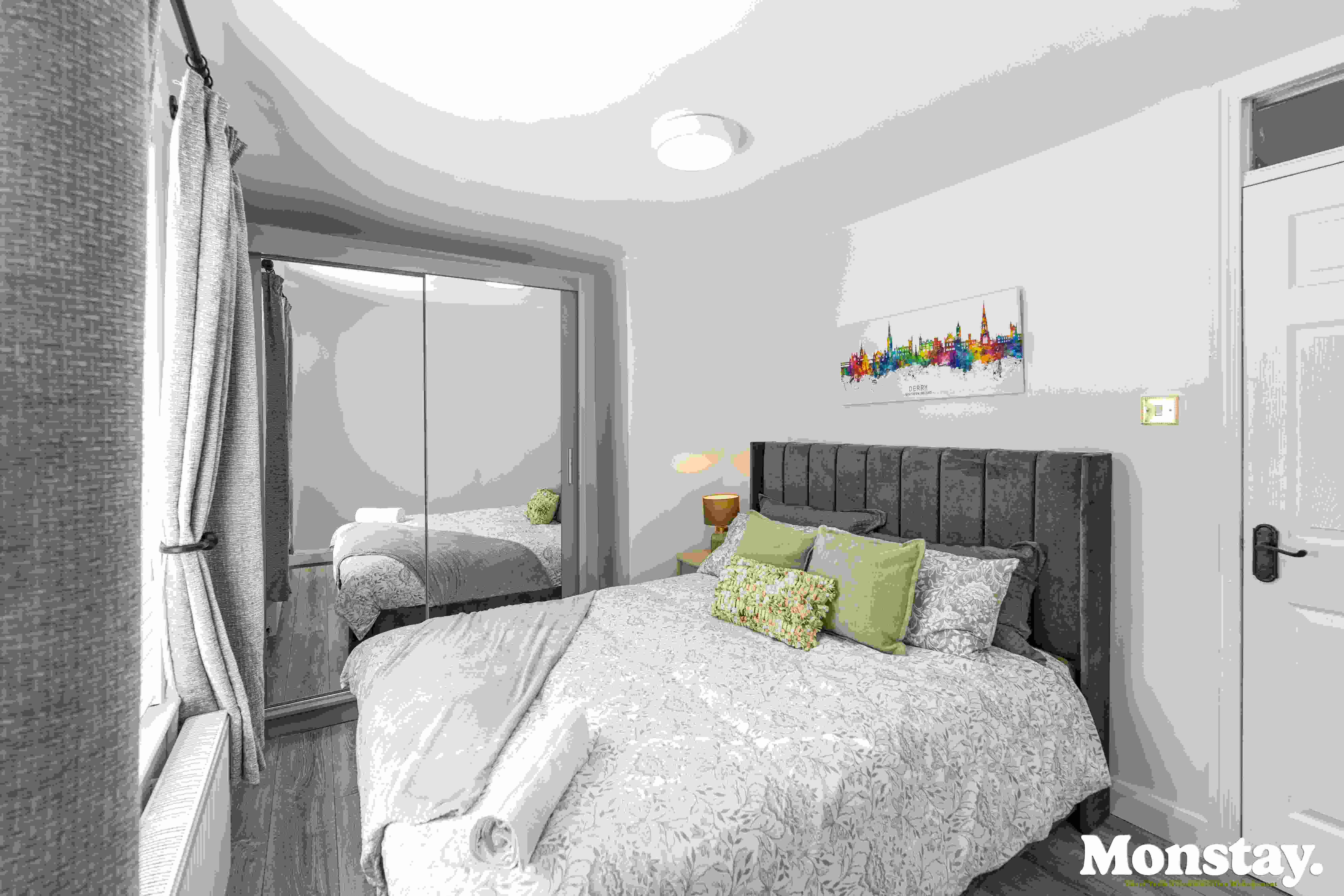 King bedroom with Derry skyline artwork at Walled City House