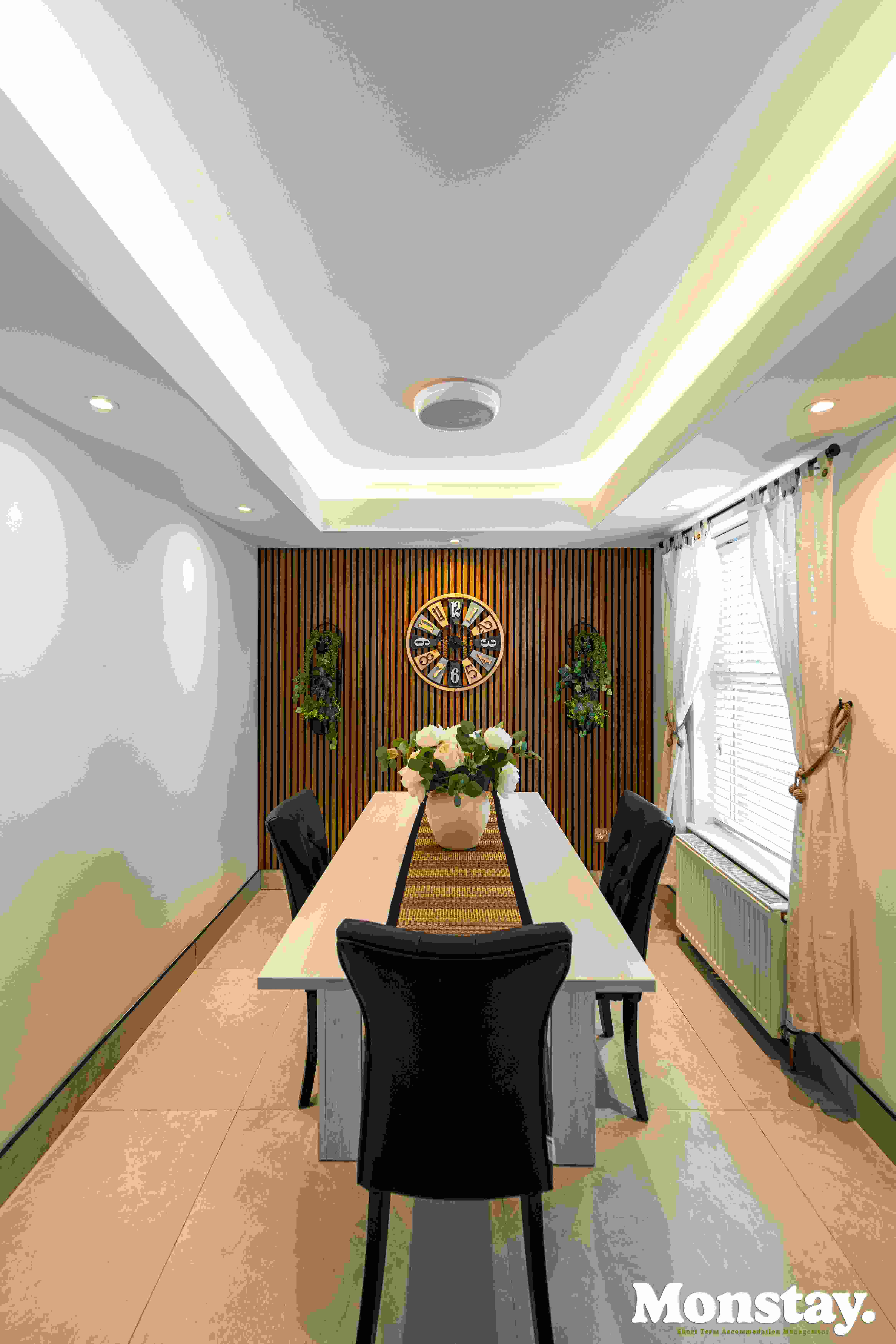 Modern dining area with seating for six at Walled City House Derry
